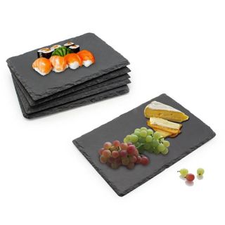 Slate cheese boards with cheese grapes and meat on