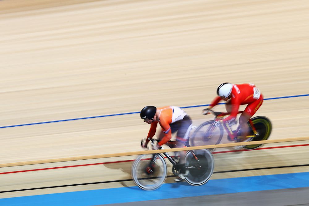 Liu Juncheng (red) of China and Roy van den Berg of the Netherlands compete in the Men's Sprint 1/16 Finals