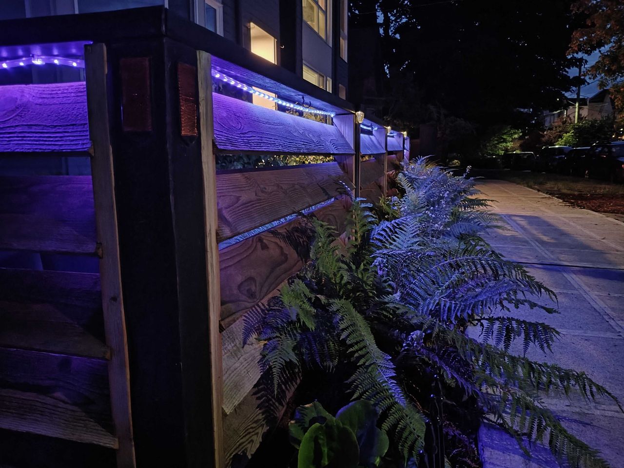 A fence lit up at night
