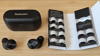 Panasonic Technics EAH-AZ80 earbuds sitting on a desk