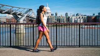 Woman Running In City Street