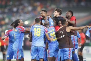 Democratic Republic of Congo players celebrate a goal against Guinea at the 2023 Africa Cup of Nations.