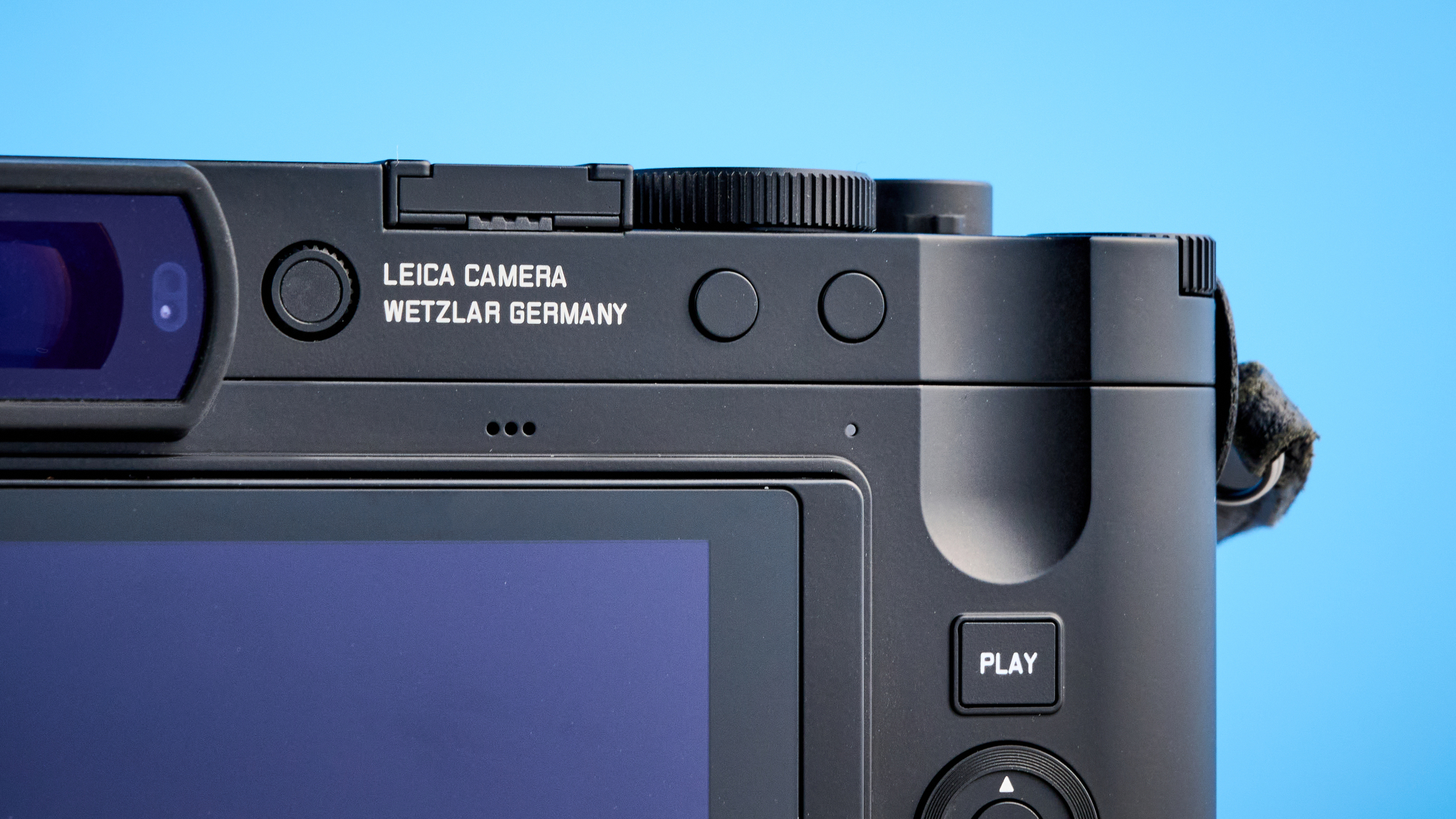 A black Leica Q3 Monochrom black-and-white mirrorless camera