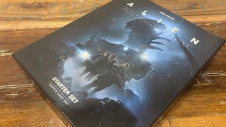 Alien RPG Evolved Edition Starter Set box laid out on a wooden table