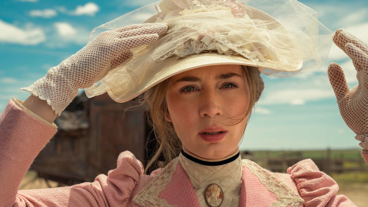 Emily Blunt in a pink dress and hat in The English