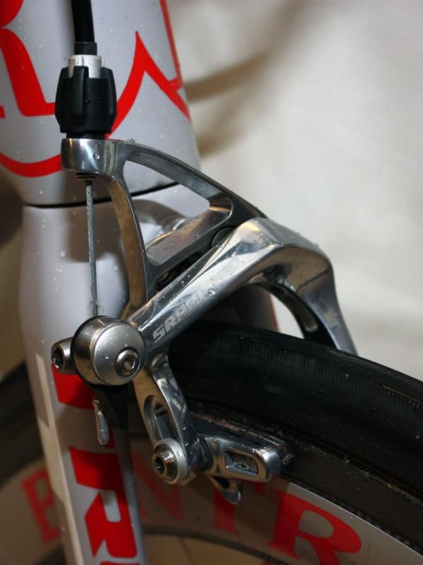 The additional tire clearance at the crown would be wholly unnoticeable were it not for the giveaway on the front brake: the pads are set several millimeters lower than usual.