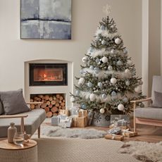 christmas tree with fireplace and armchair