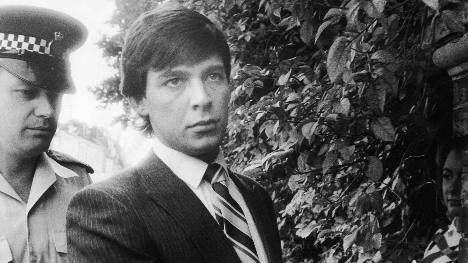 Jeremy Bamber being lead into Chelmsford Crown Court at the start of his trial