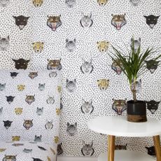 bedroom with wildcats wallpaper and plant pot