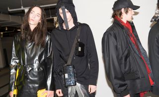 Matthew Miller S/S 2019 - Shoulder bags and straps hang over models faces