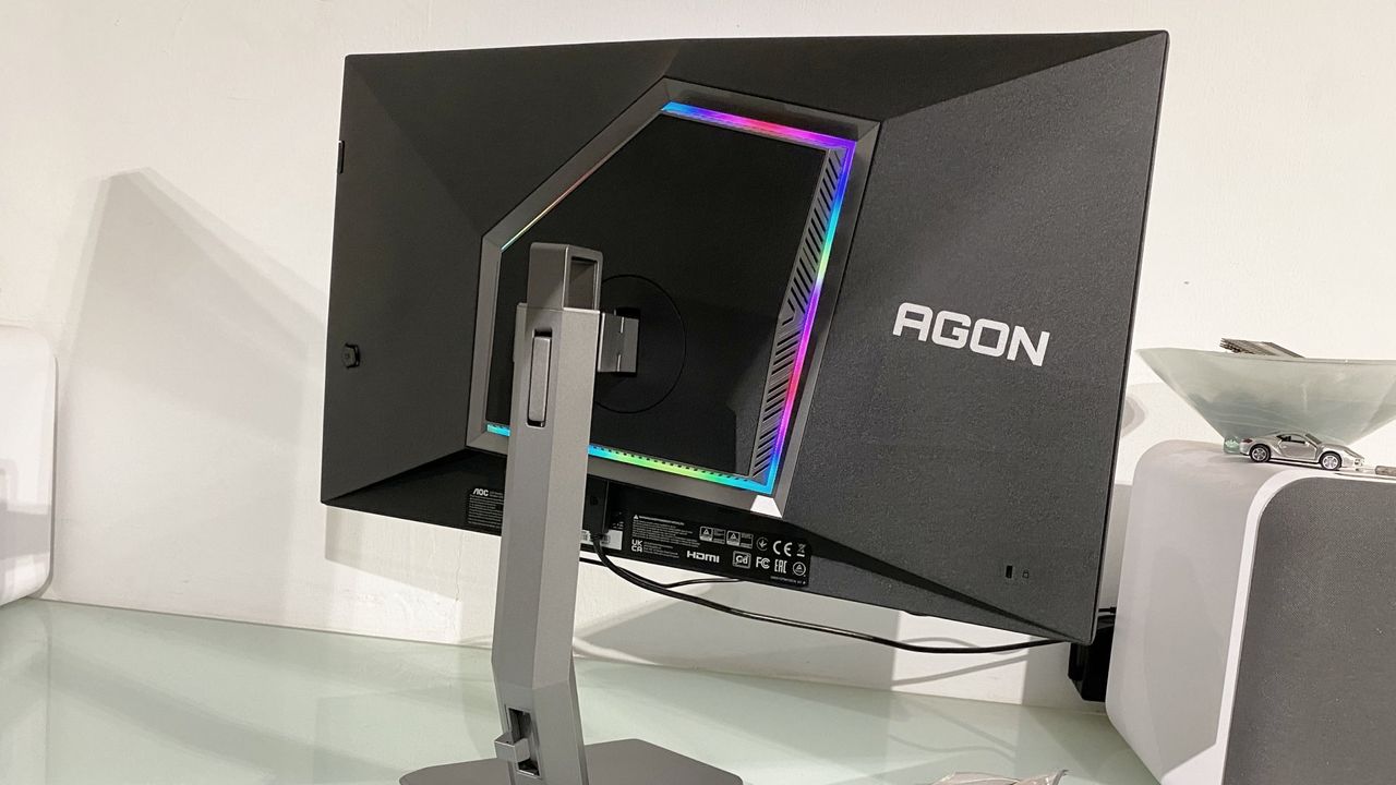 Back of the AOC Agon Pro AG276FK gaming monitor, showing RGB lighting and adjustable stand