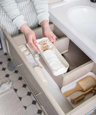 Organizing and putting away in a bathroom drawer
