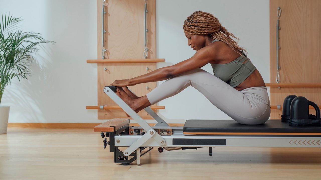 Pilates sculpt bar: A woman doing Pilates