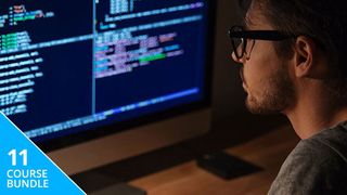 Man looking at a computer screen filled with code