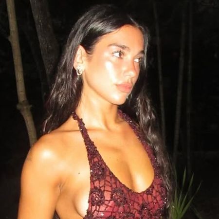 Dua Lipa wears a red lace crochet dress and celebrates her birthday