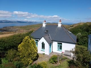 Painted white exterior of Irish cottage