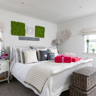 white bedroom with bed and baskets