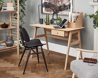 Ercol Ballatta Desk in home office environment by Furniture Village