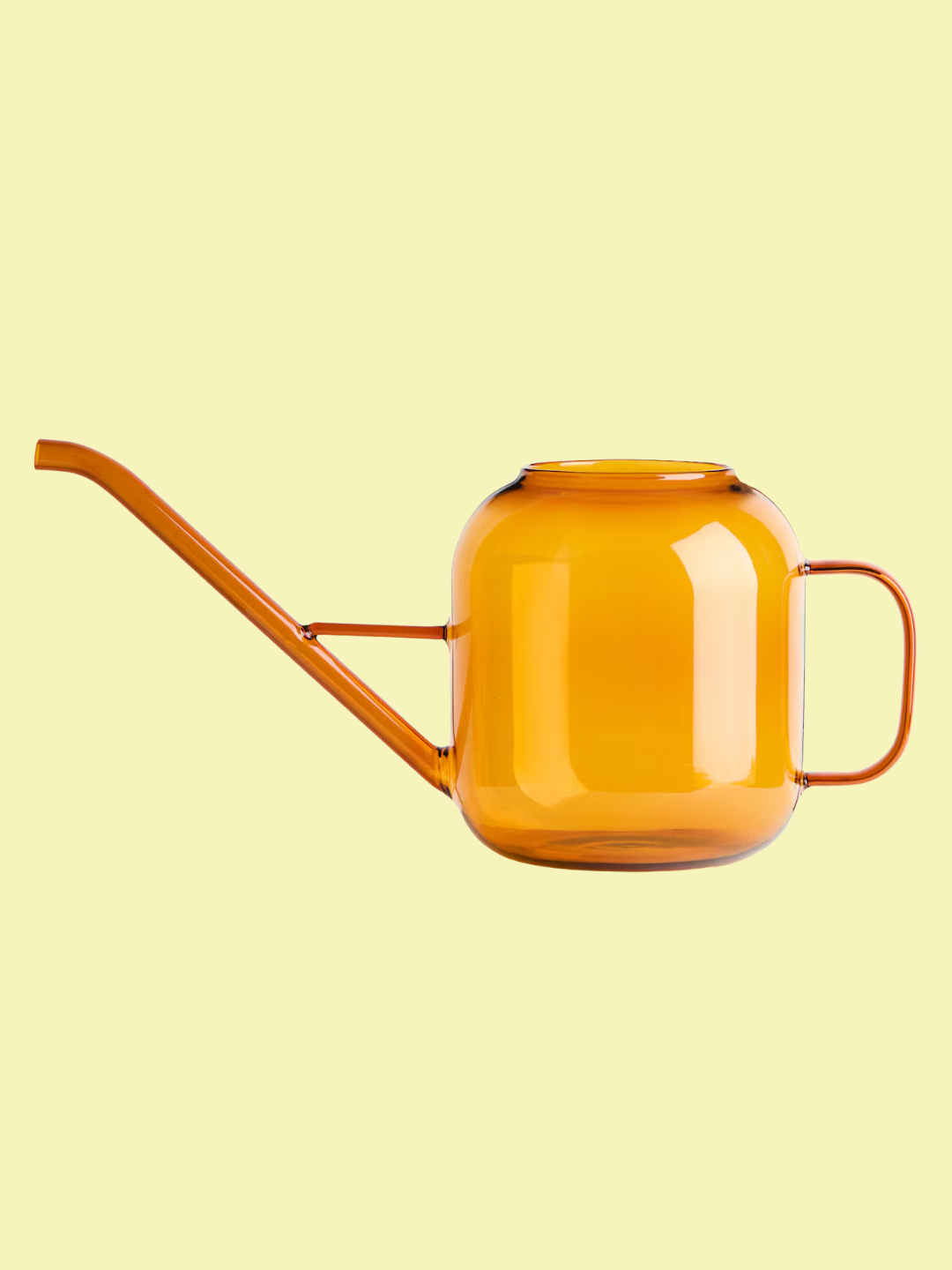 An orange glass watering can from H&amp;amp;M