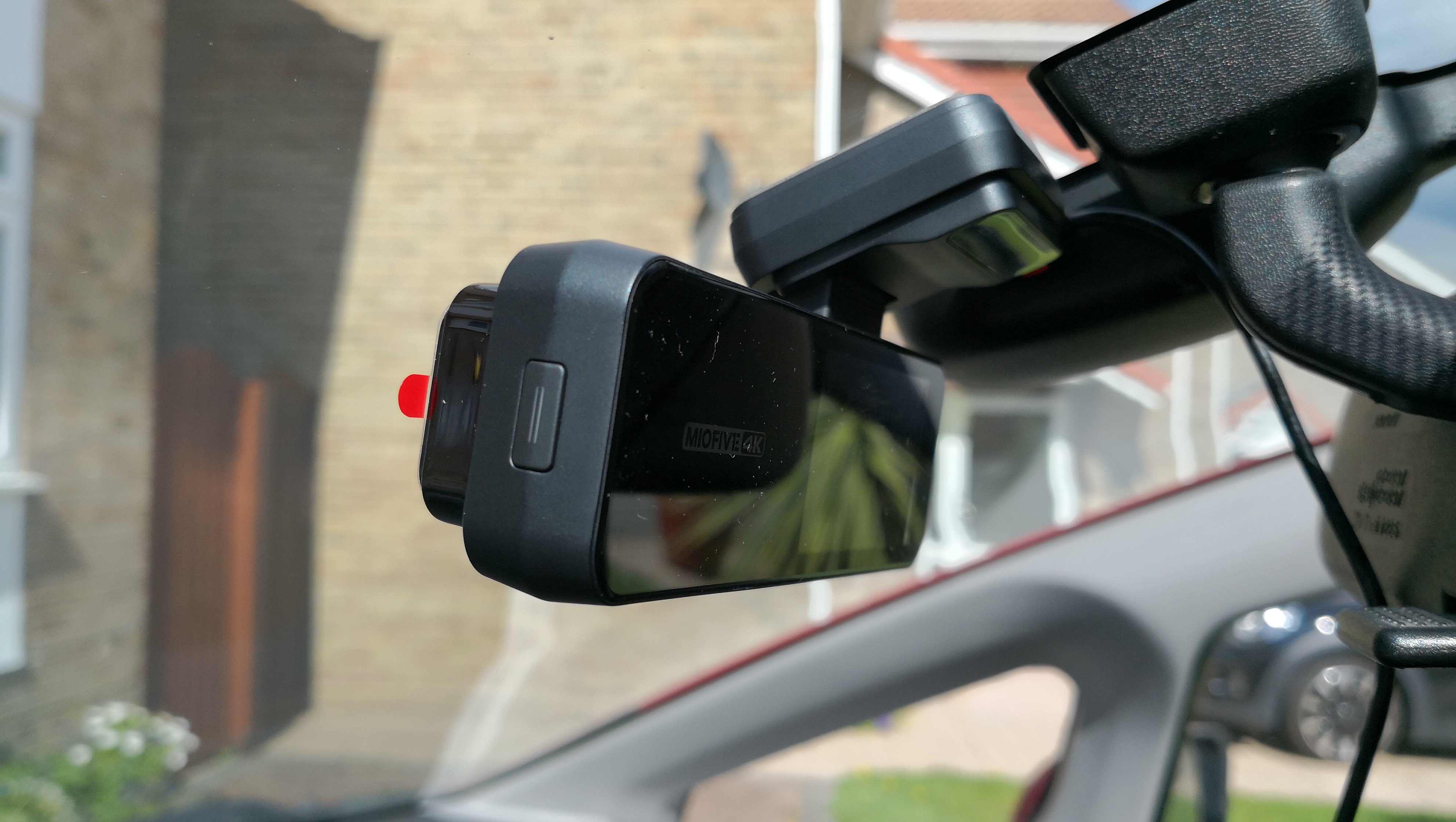 The Miofive 4K dash cam mounted on a car windshield