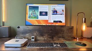 M2 Mac mini on a wooden desk