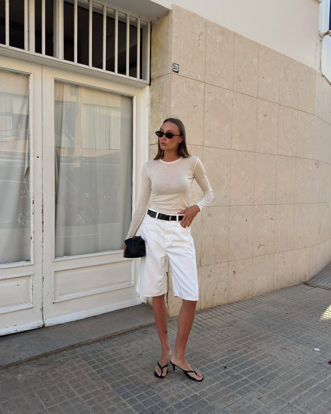 @martynakarolak wearing heeled flip-flops