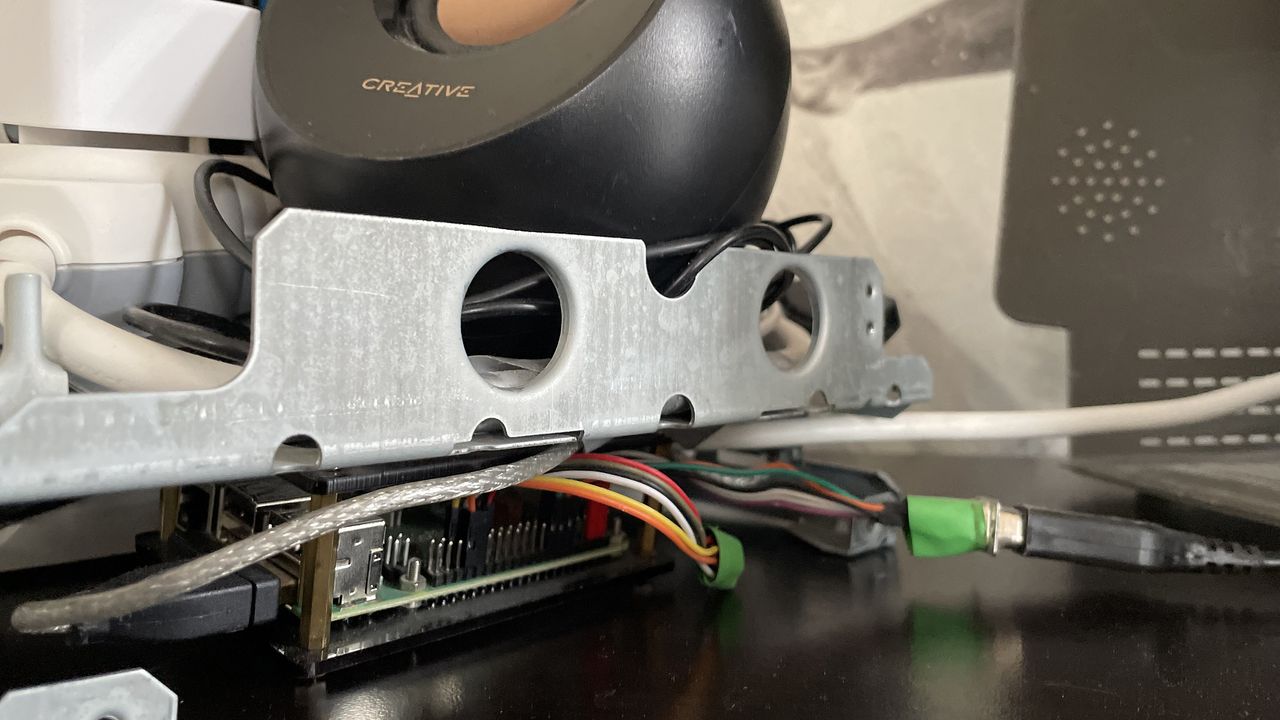 A close up of the speaker inside the MacintoshPi and connections