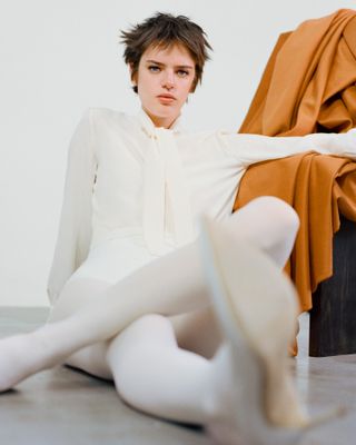 Pre Fall 2024 Best Looks Fashion Shoot featuring woman on floor in white outfit