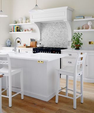 white kitchen with island and open shelving