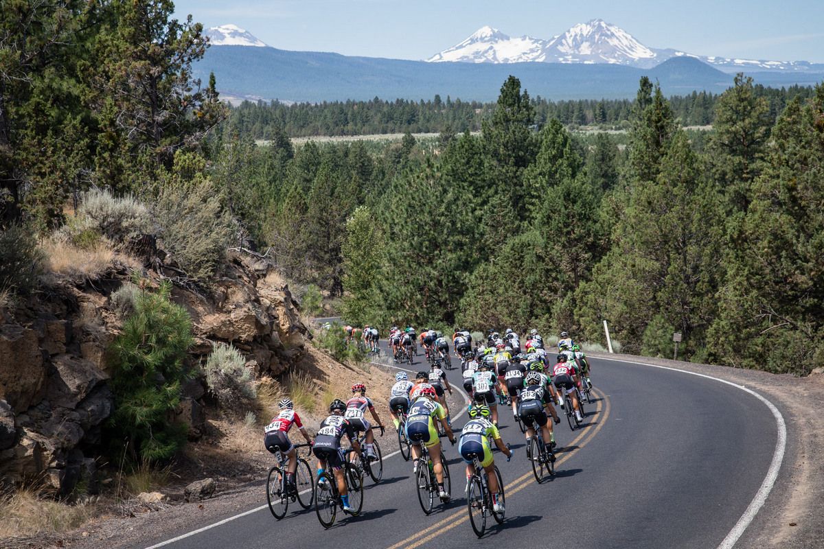 The women's peloton descends onto the back side of the course