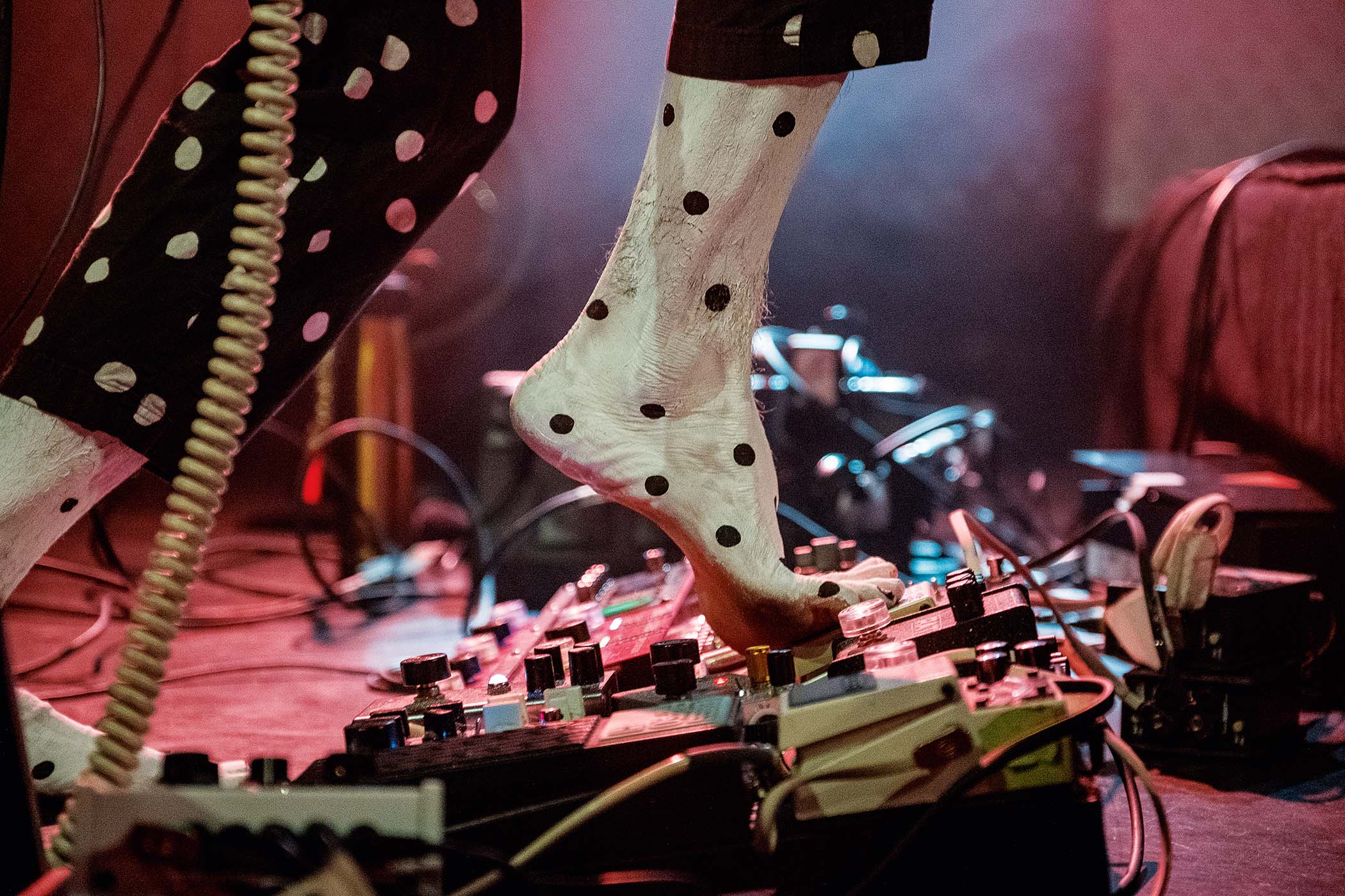 Angine de Poitrine masked up in polka-dots perform live
