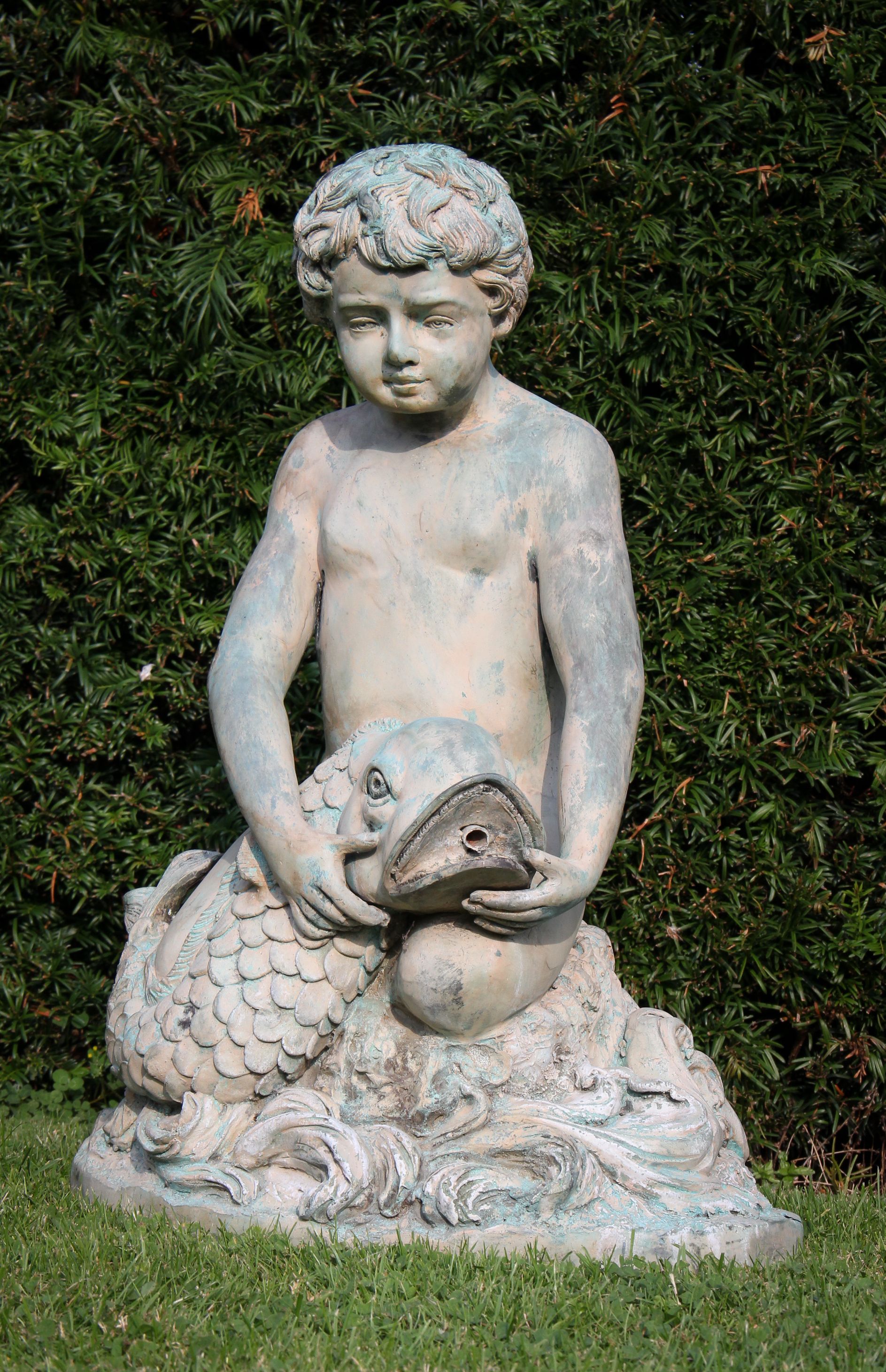 Fountain boy garden statue