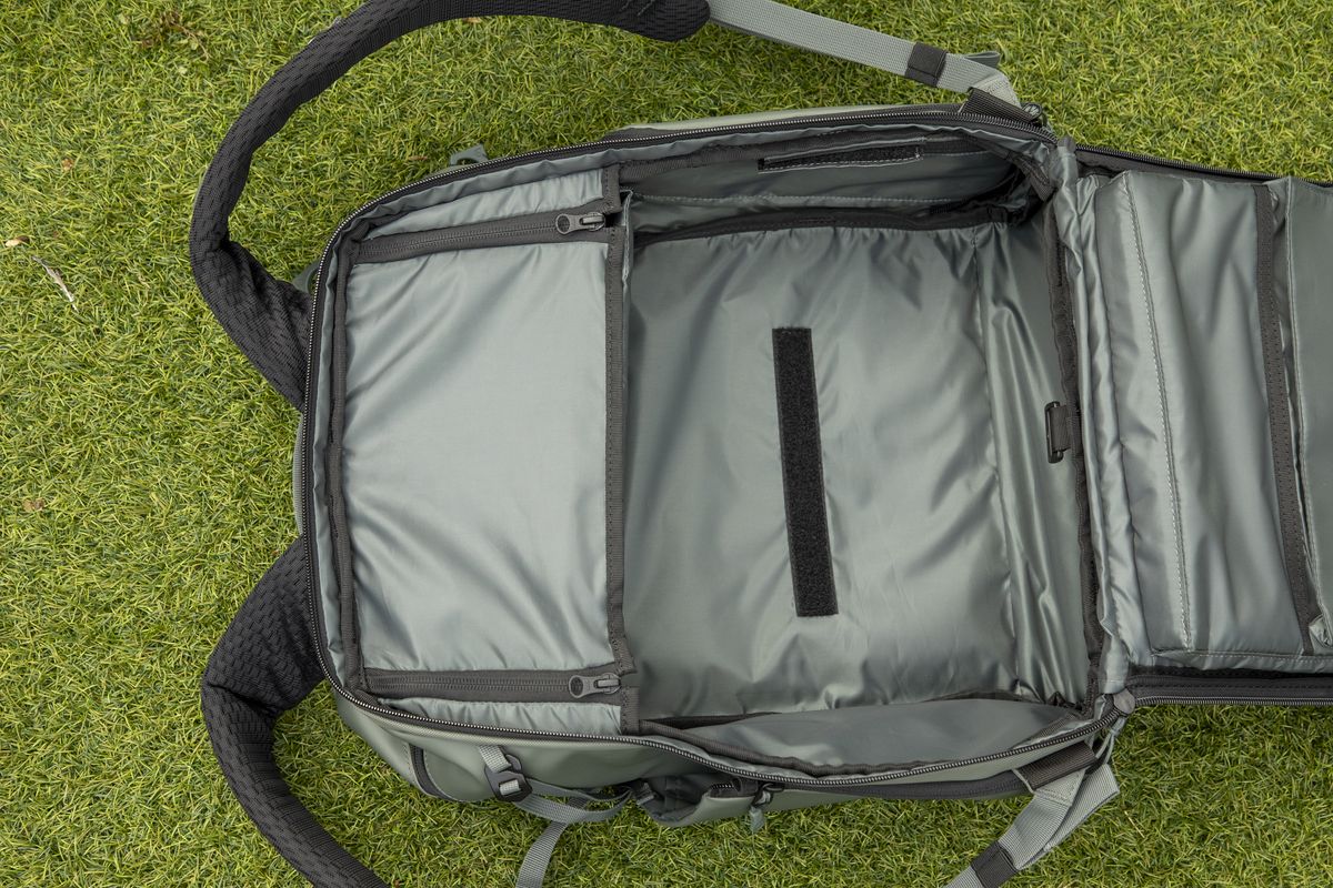 inside a camera backpack with internal dividers, being removed