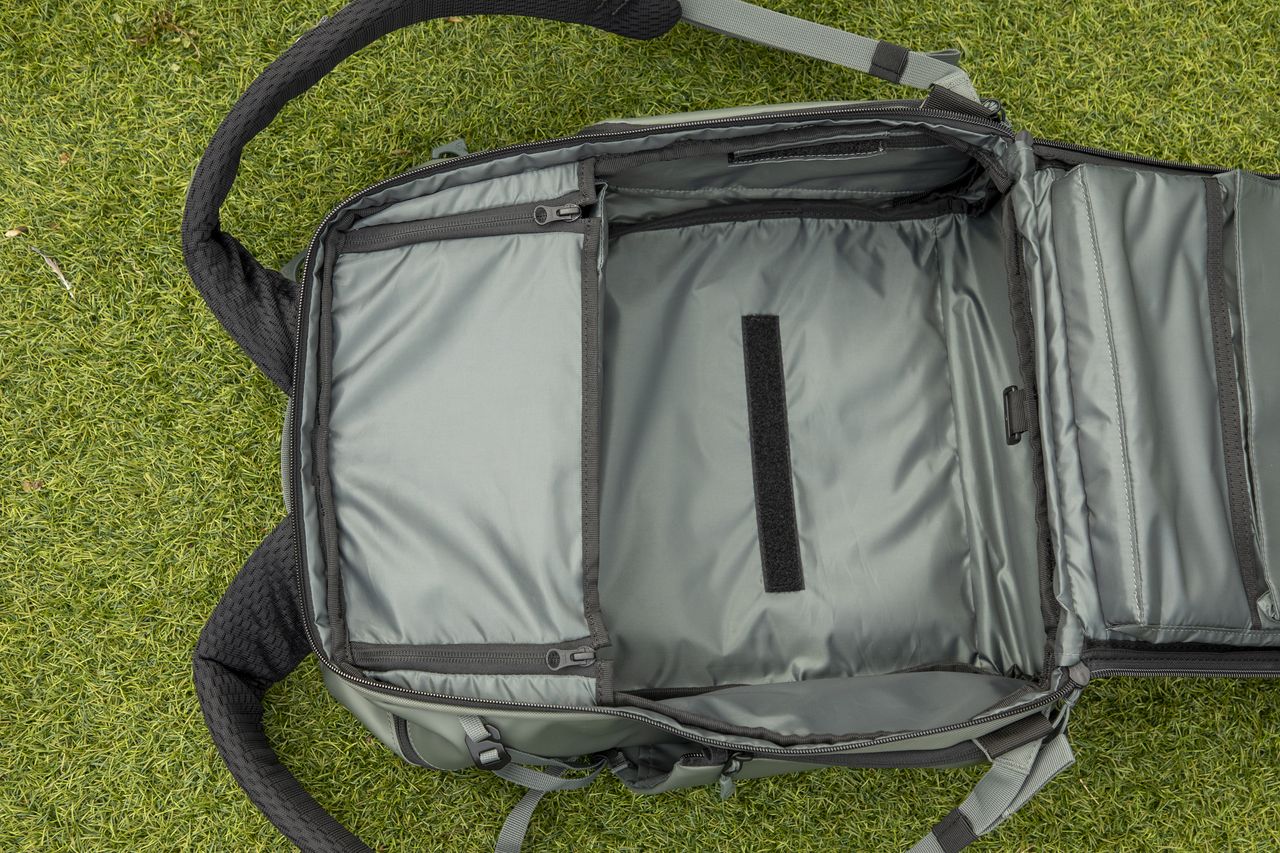 inside a camera backpack with internal dividers, being removed