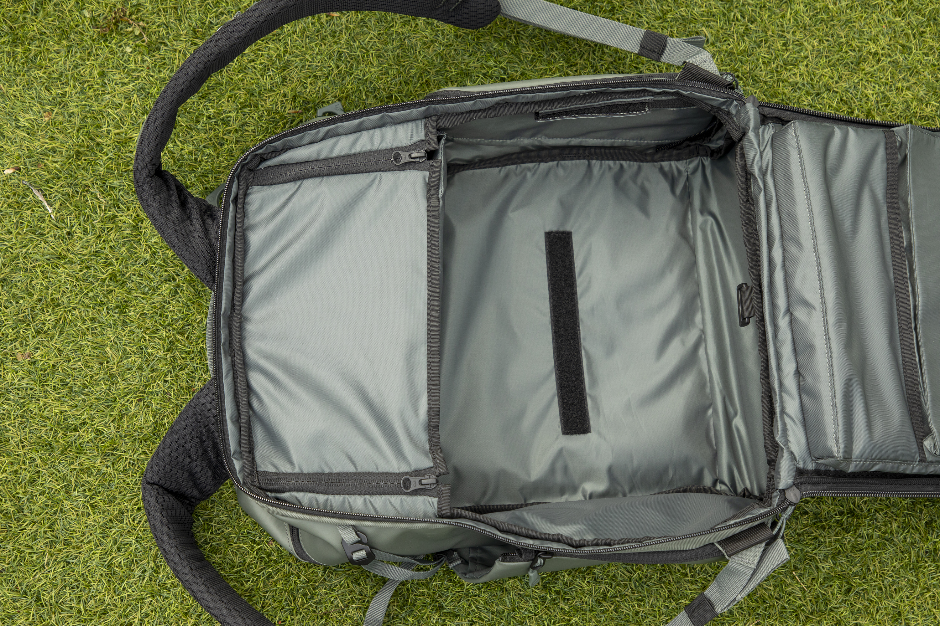 inside a camera backpack with internal dividers, being removed