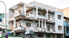 image of white everyday building of Vietnamese modernist architecture
