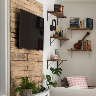 living room white wall wooden shelf and wooden tv console