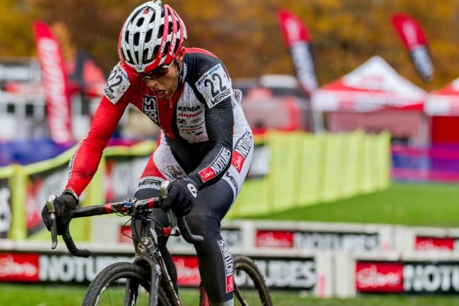 Wells in the red, maintaining his fourth place position out on course.