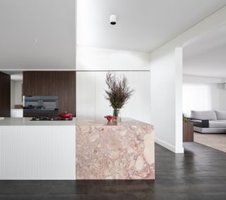 A kitchen counter with pink marble
