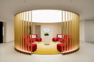 Gold enclosure and red seating area at Cartier Japan HQ
