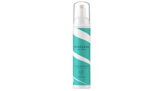 A bottle of Boucleme's foaming dry shampoo.