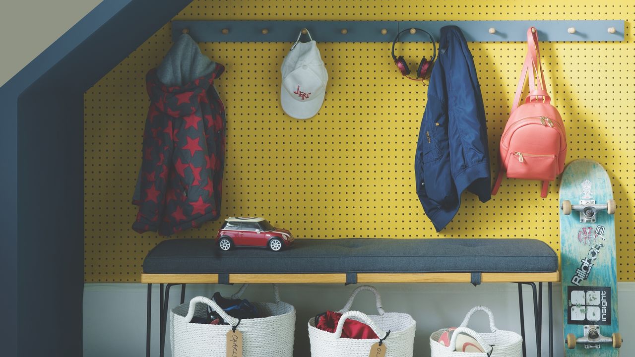 Under stairs organiser with peg rail, bench and baskets