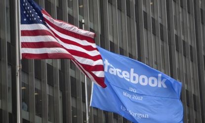 A flag announcing the IPO of Facebook flies outside the JPMorgan office in New York City: GM dropped its paid advertisements from the social media site this week.