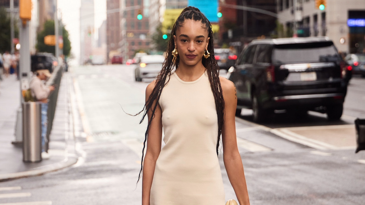 woman wearing tan dress in new york city