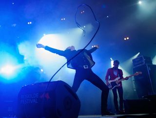 Dennis Lyxzen of Refused at full tilt during Roskilde Festival, 2012
