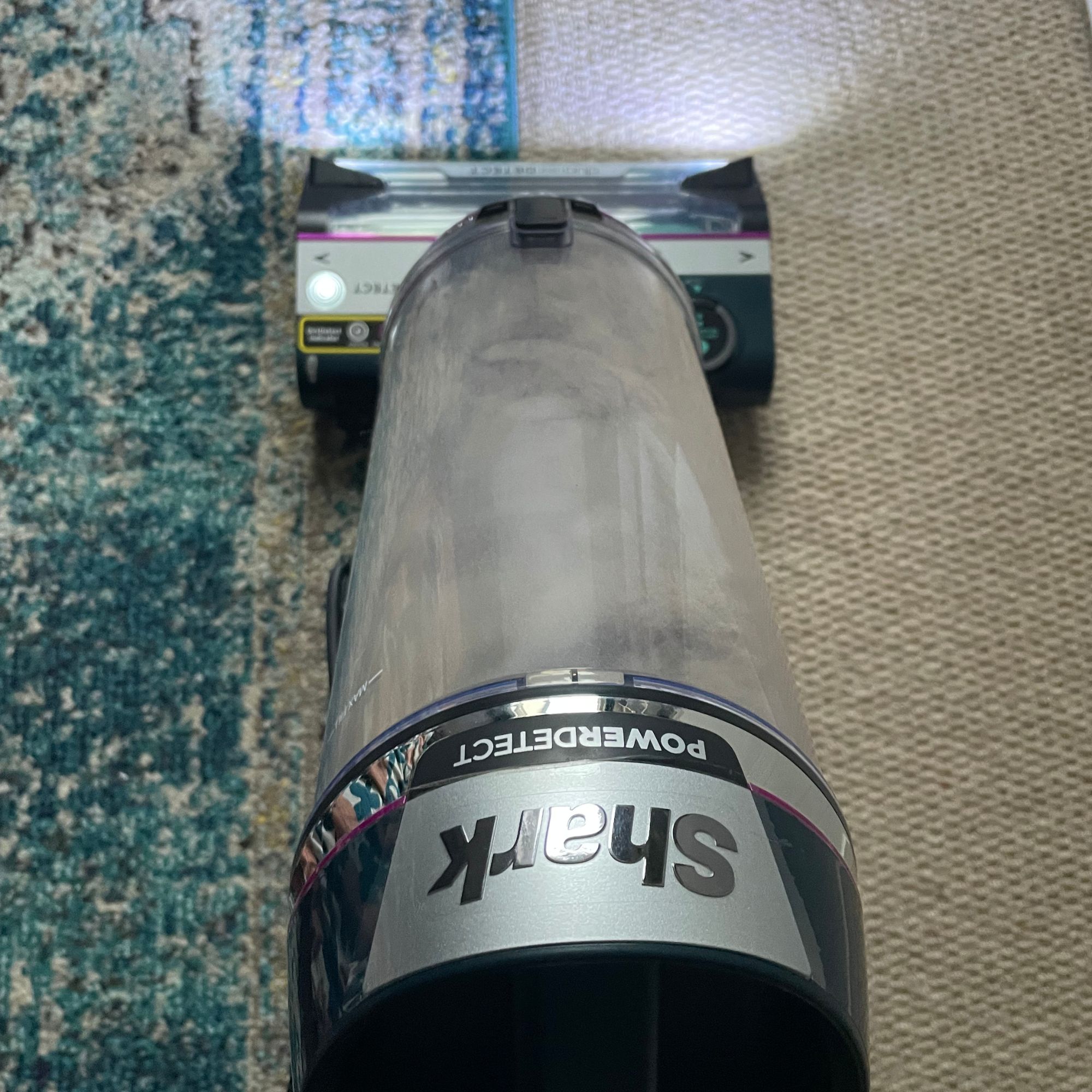 Using the Shark PowerDetect Powered Lift-Away Upright Pet Vacuum Cleaner AZ3900UKT on cream carpet and a blue rug