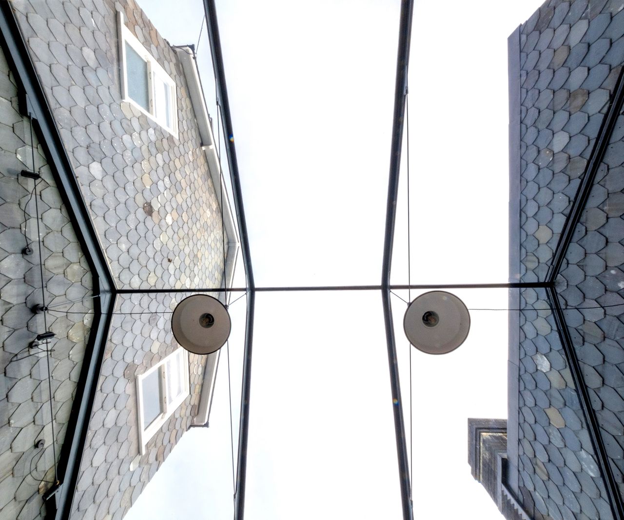 Pitched glass roof over a side extension