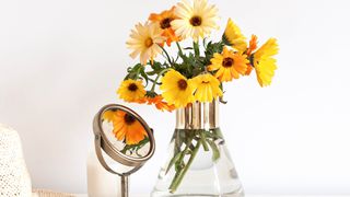 Marigolds in glass vase