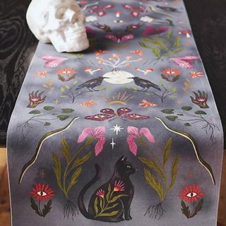 A purple embroidered table runner