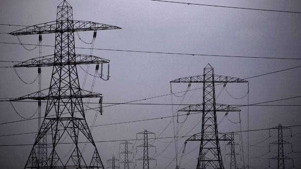 BRIDGWATER, UNITED KINGDOM - FEBRUARY 28:Grey clouds form above pylons carrying electricity generated from Hinkley Point B&amp;#039;s Advanced Gas-cooled Reactor at the Hinkley Point nuclear power sta